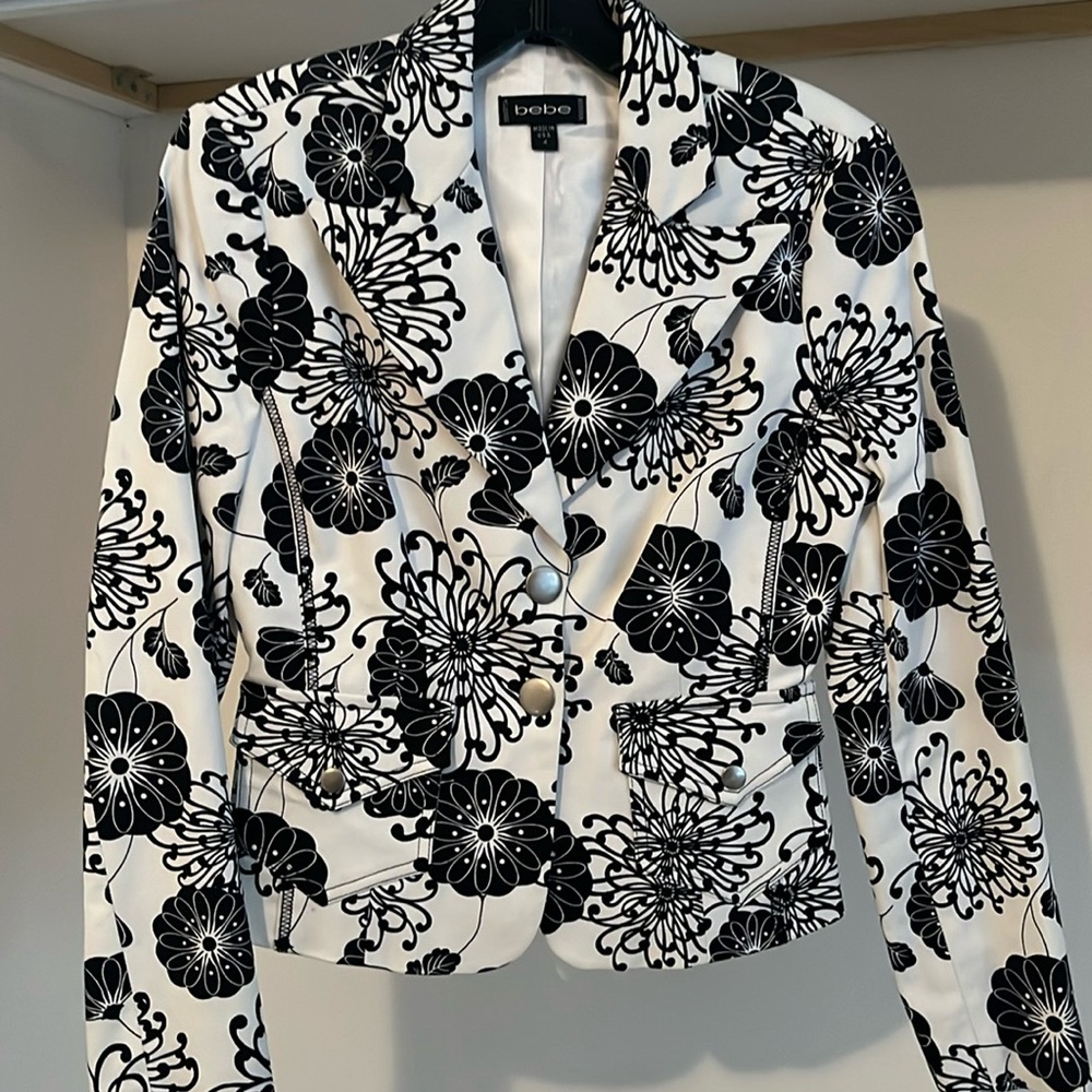 Black and white blazer for work attire .
